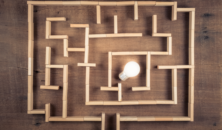 Disability insurance marketing ideas with a maze and lightbulb.