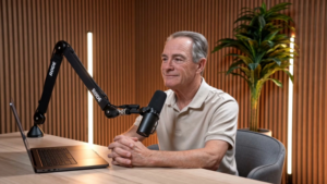 Howard Hanger, Regional Director of Disability Insurance Sales, sitting at a microphone.