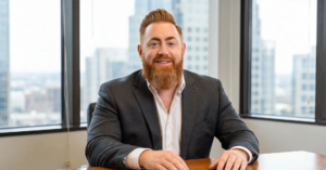 Iain MacDonald, disability insurance Sales Rep sitting at a desk.